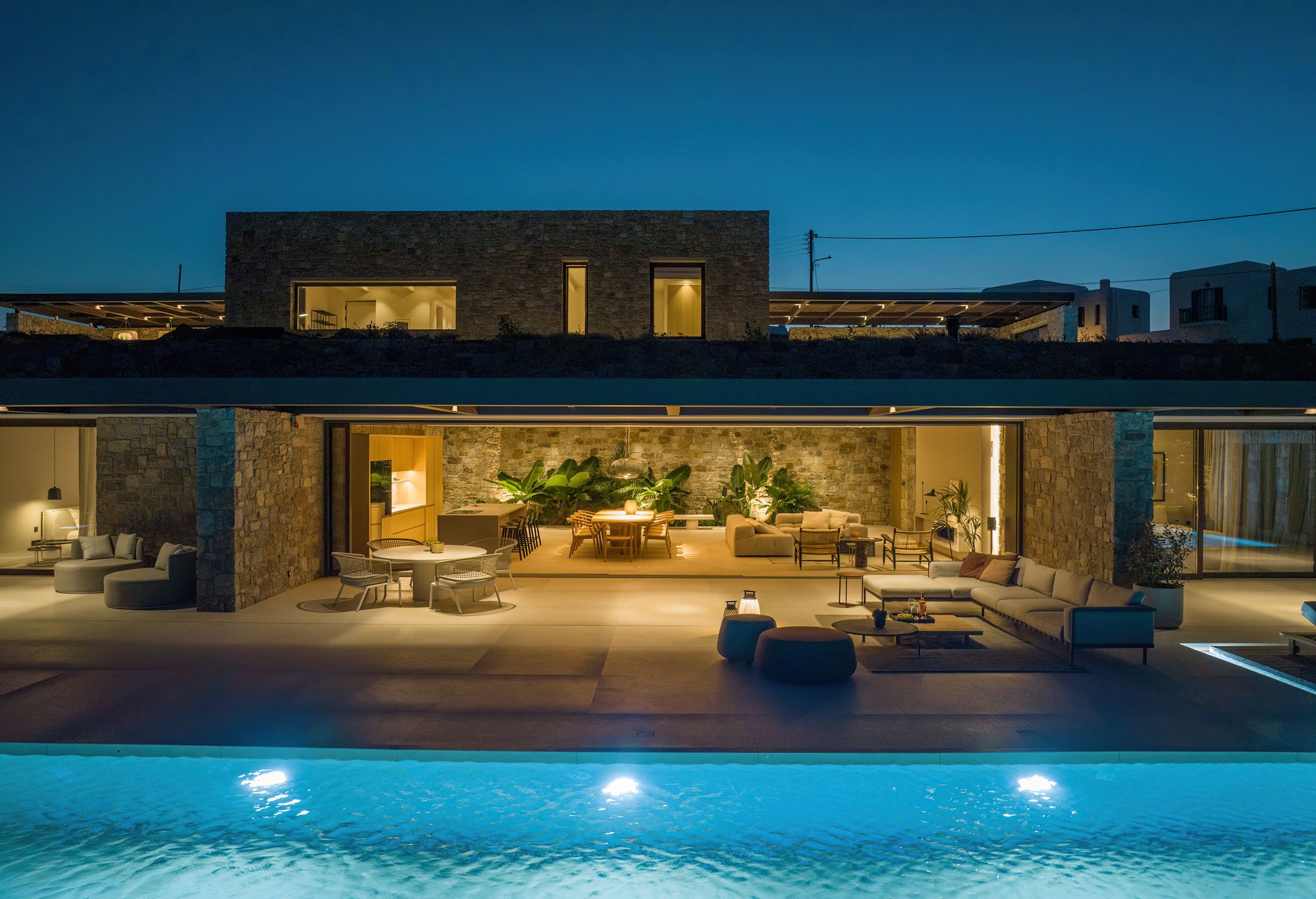 Villa and illuminated pool at night at Aether Private Retreat - Ground Floor, Aleomandra, Mykonos