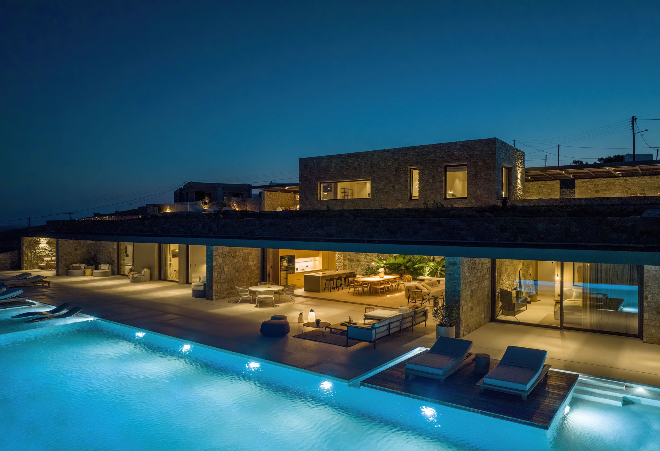 Infinity pool lit at night beside the villa at Aether Private Retreat - Ground Floor, Aleomandra, Mykonos