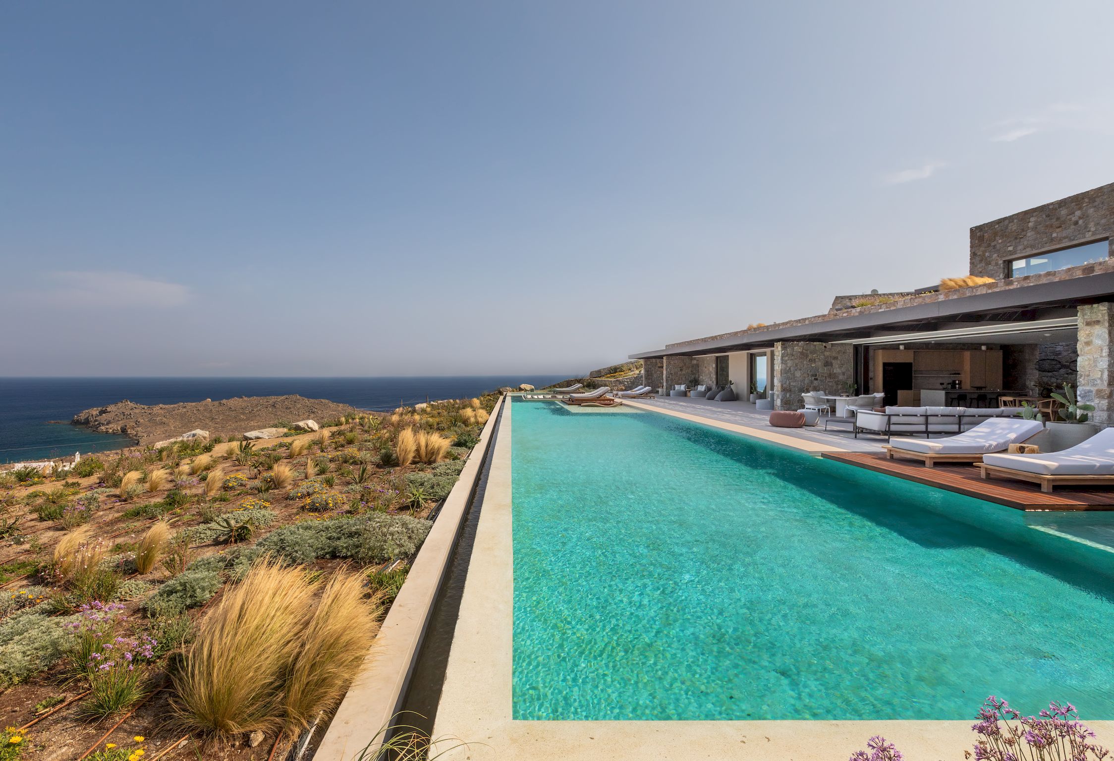 Long infinity pool stretching towards the sea and countryside at Aether Private Retreat - Ground Floor, Aleomandra, Mykonos