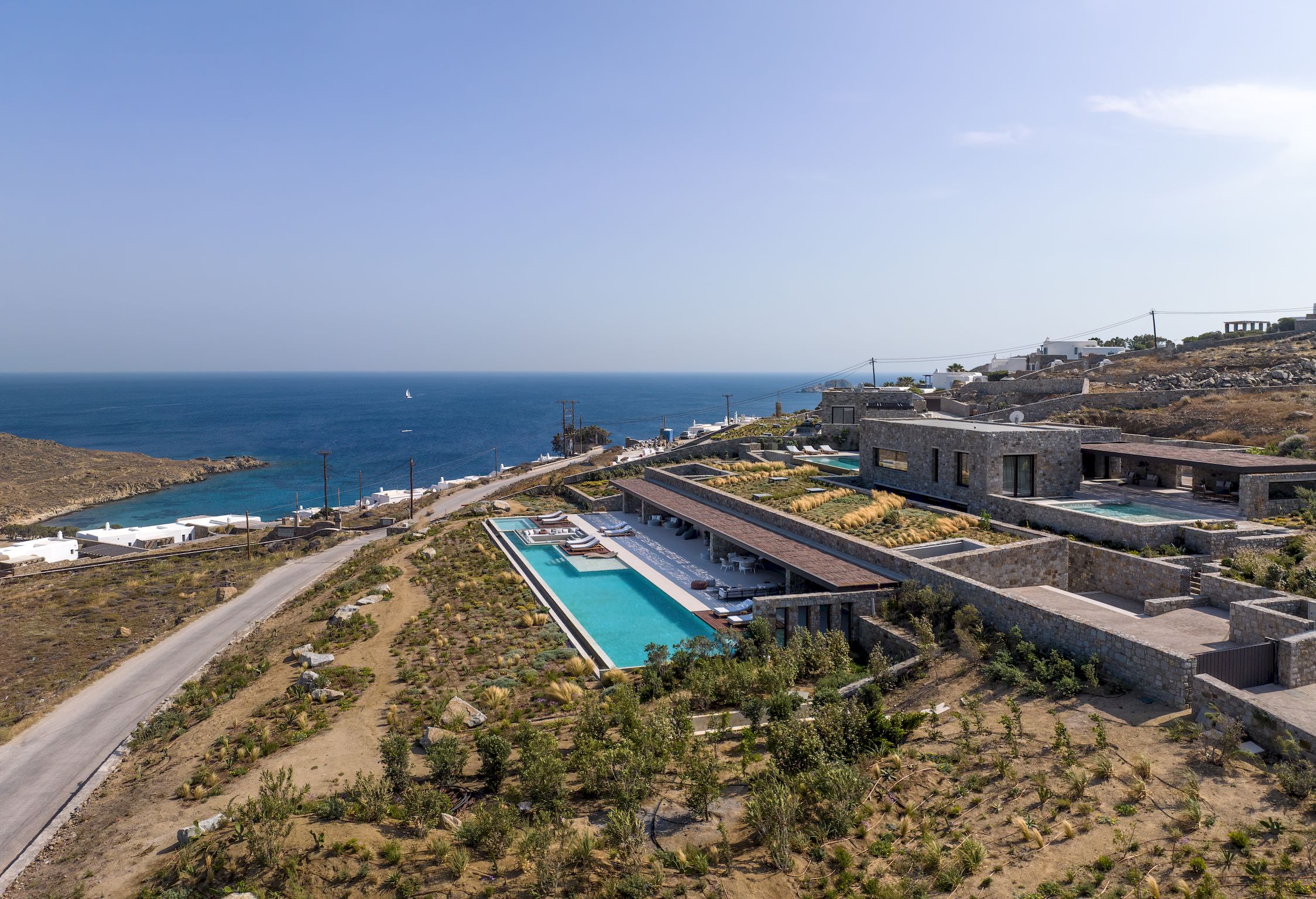 Aerial view of the villa, pools and surrounding Aleomandra landscape at Aether Private Retreat - Ground Floor, Aleomandra, Mykonos