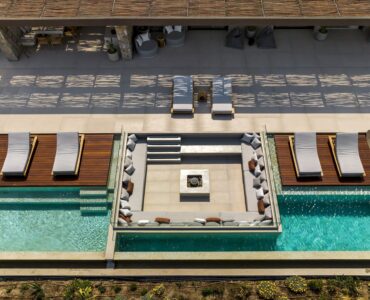 Top-down aerial view of the pool deck and sun loungers at Aether Private Retreat - Ground Floor, Aleomandra, Mykonos