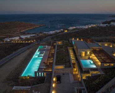 Aerial view of the villa and illuminated pools at night at Aether Private Retreat - Ground Floor, Aleomandra, Mykonos