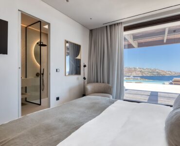 Bedroom with large window and sea view at Aether Private Retreat - Ground Floor, Aleomandra, Mykonos
