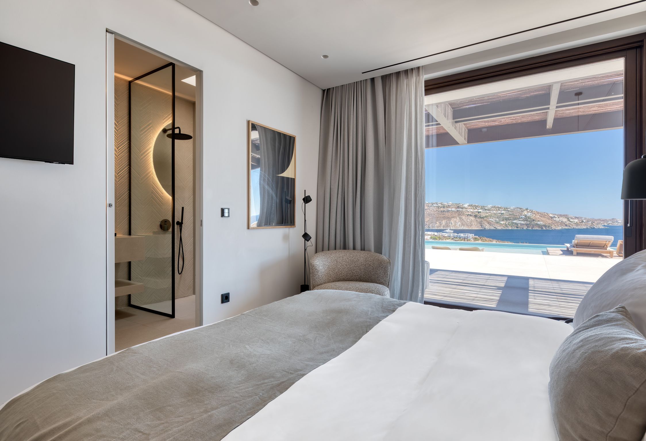 Bedroom with large window and sea view at Aether Private Retreat - Ground Floor, Aleomandra, Mykonos