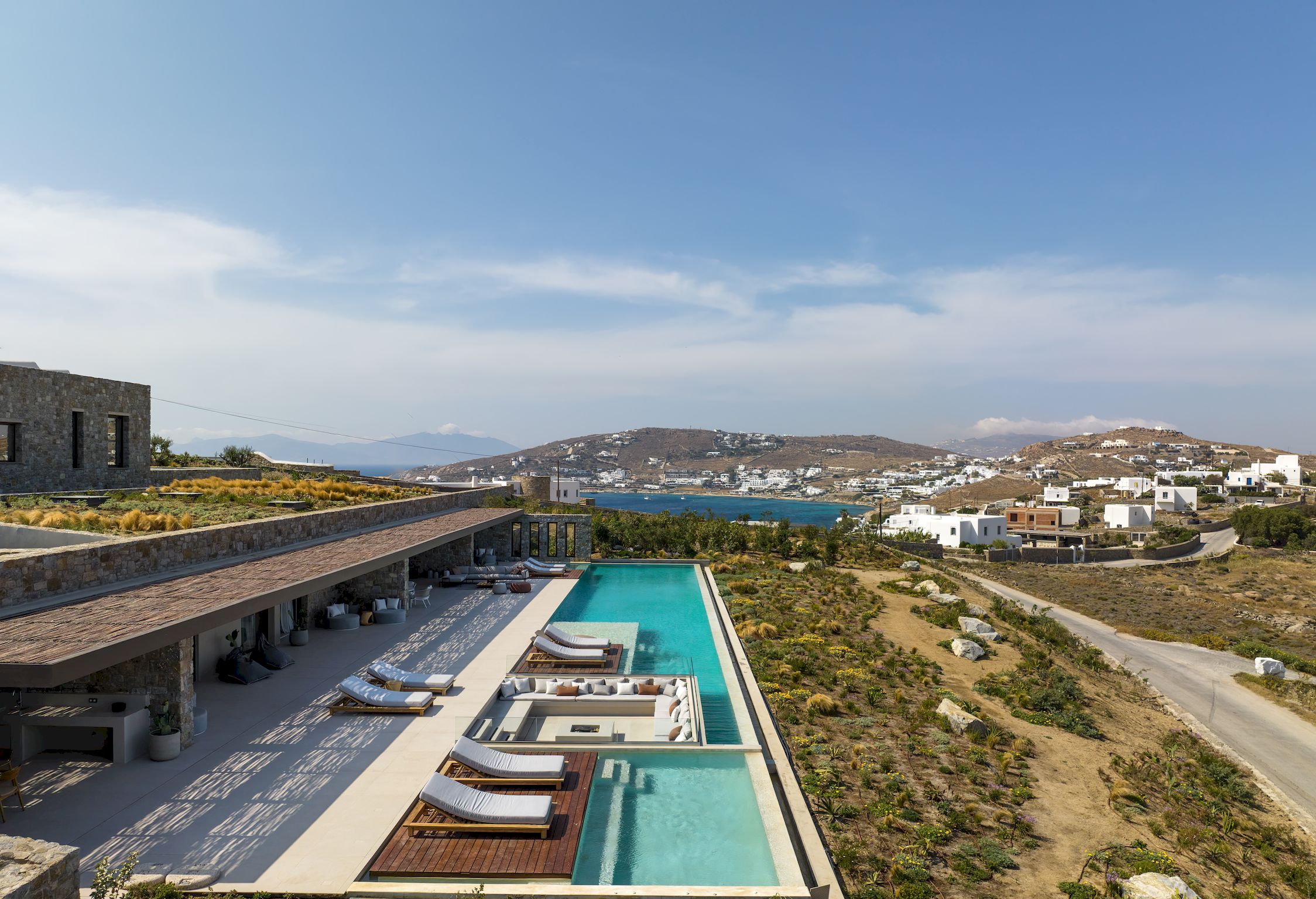 Aerial view of the villa, pools and surrounding Aleomandra landscape at Aether Private Retreat - Ground Floor, Aleomandra, Mykonos