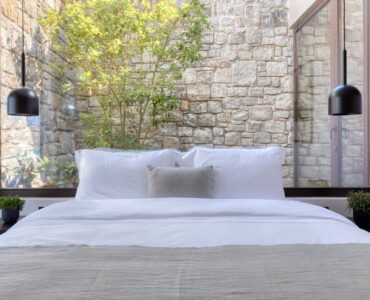 Bedroom with picture window onto the planted garden at Aether Private Retreat - Ground Floor, Aleomandra, Mykonos