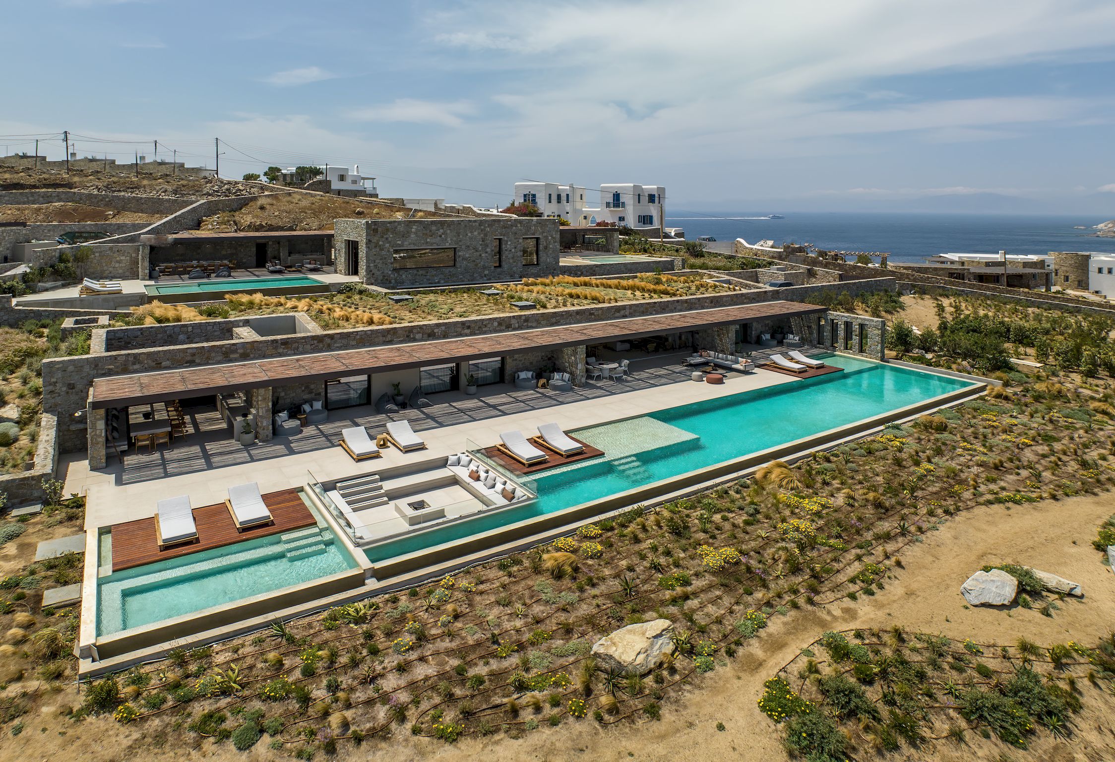 Aerial view of the villa, pools and surrounding Aleomandra landscape at Aether Private Retreat - Ground Floor, Aleomandra, Mykonos