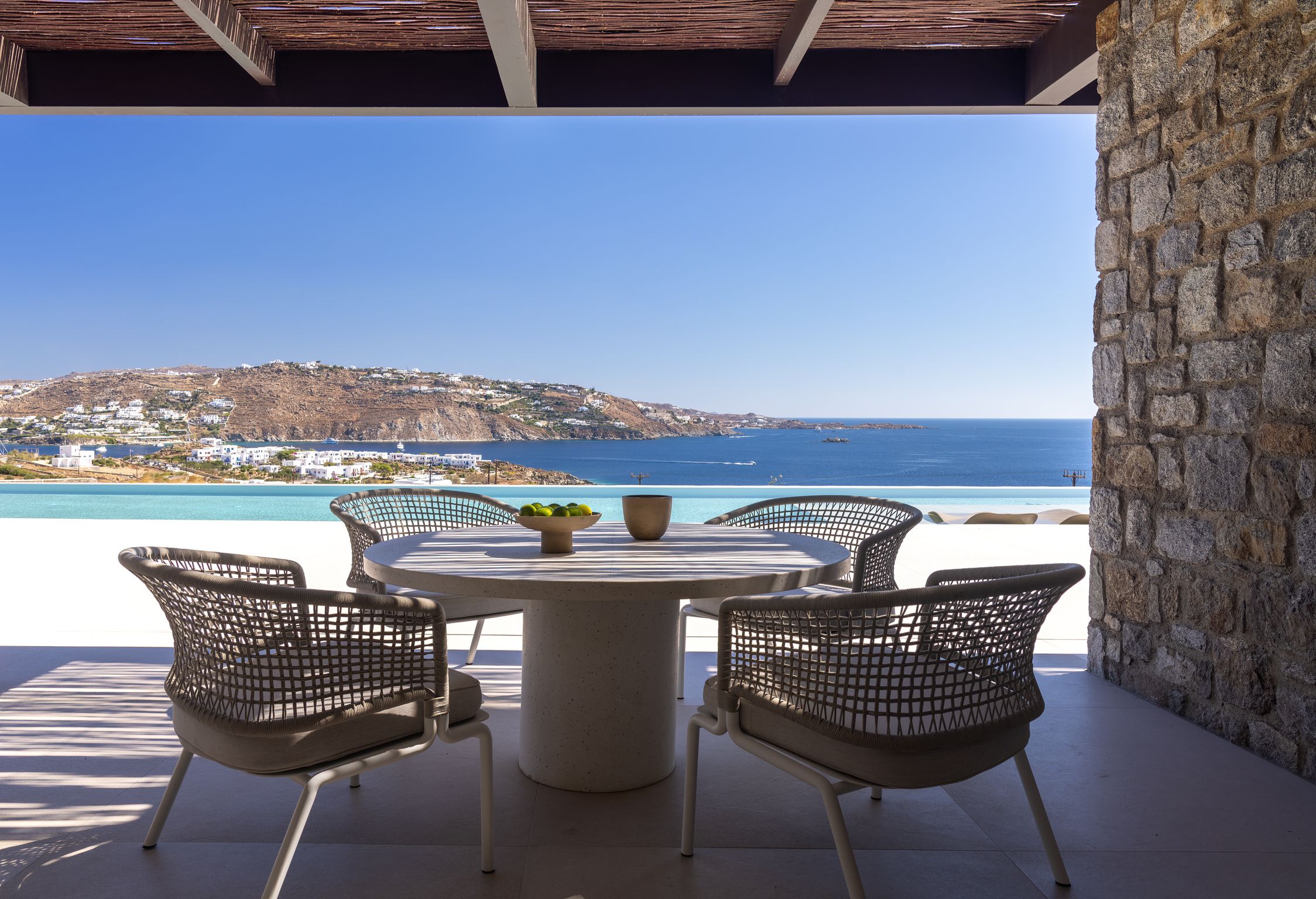 Outdoor dining table with views over the Aegean at Aether Private Retreat - Ground Floor, Aleomandra, Mykonos