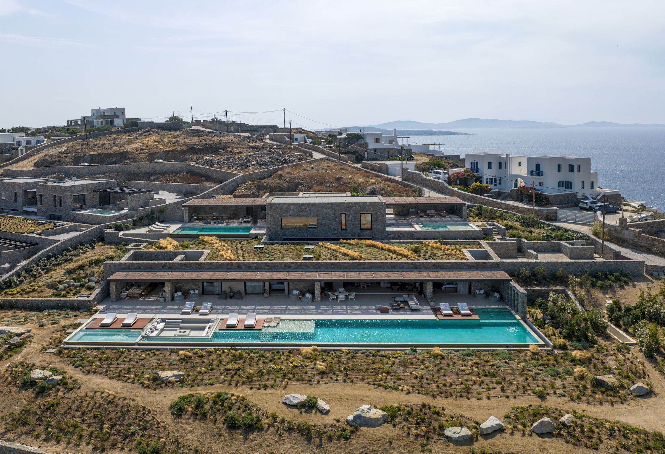 Aerial view of the villa, pools and surrounding Aleomandra landscape at Aether Private Retreat - Ground Floor, Aleomandra, Mykonos