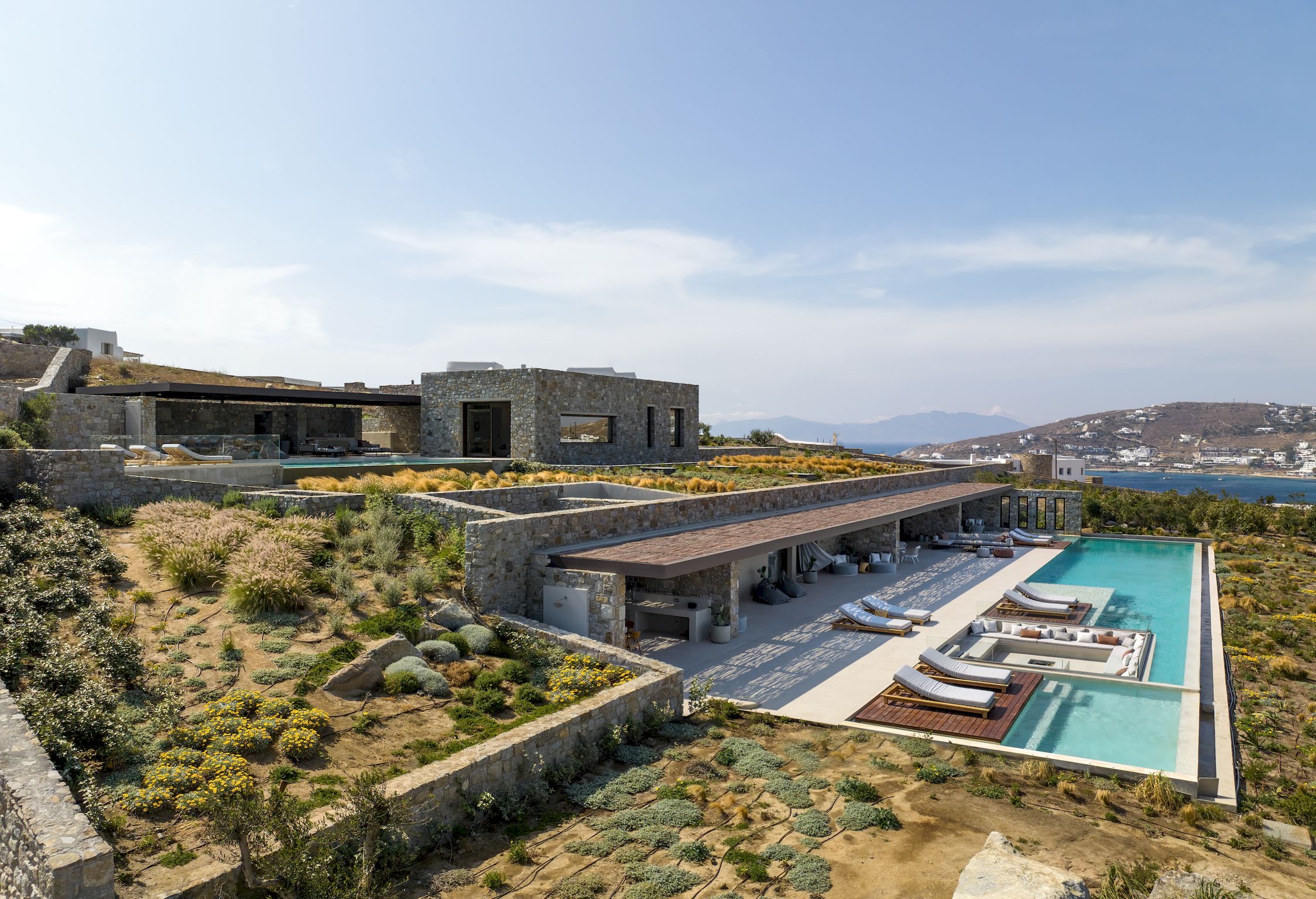 Aerial view of the villa, pools and surrounding Aleomandra landscape at Aether Private Retreat - Ground Floor, Aleomandra, Mykonos