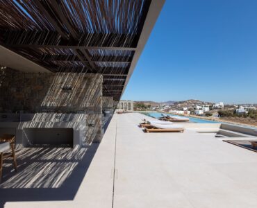 Stone terrace with timber pergola and sea views at Aether Private Retreat - Ground Floor, Aleomandra, Mykonos