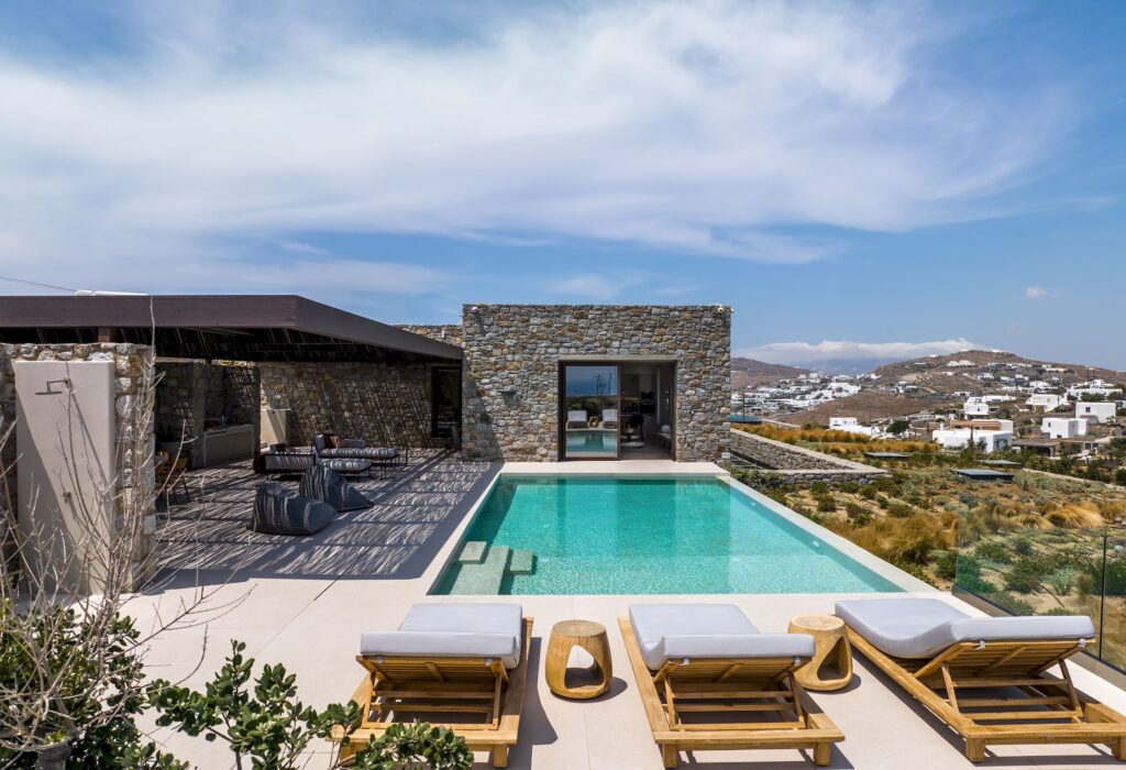 Private pool with sun loungers beside the stone-built villa at Aether Private Retreat - Upper Floor, Aleomandra, Mykonos