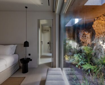 Bedroom with picture window onto the planted garden at Aether Private Retreat - Upper Floor, Aleomandra, Mykonos