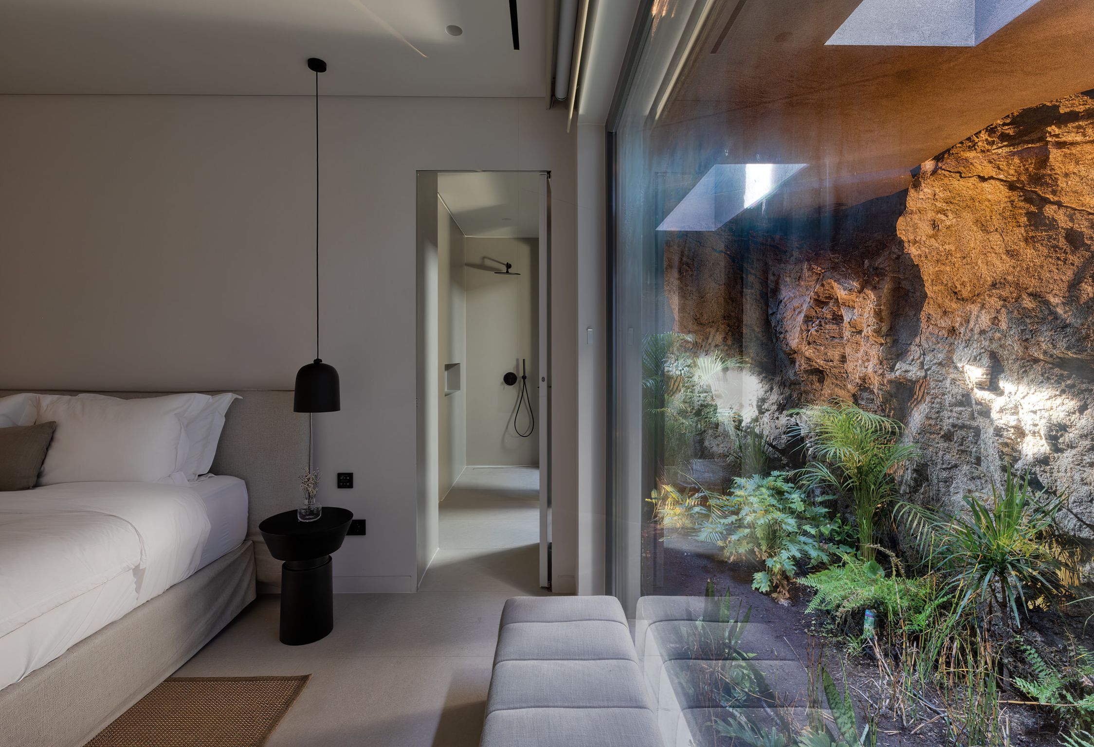 Bedroom with picture window onto the planted garden at Aether Private Retreat - Upper Floor, Aleomandra, Mykonos