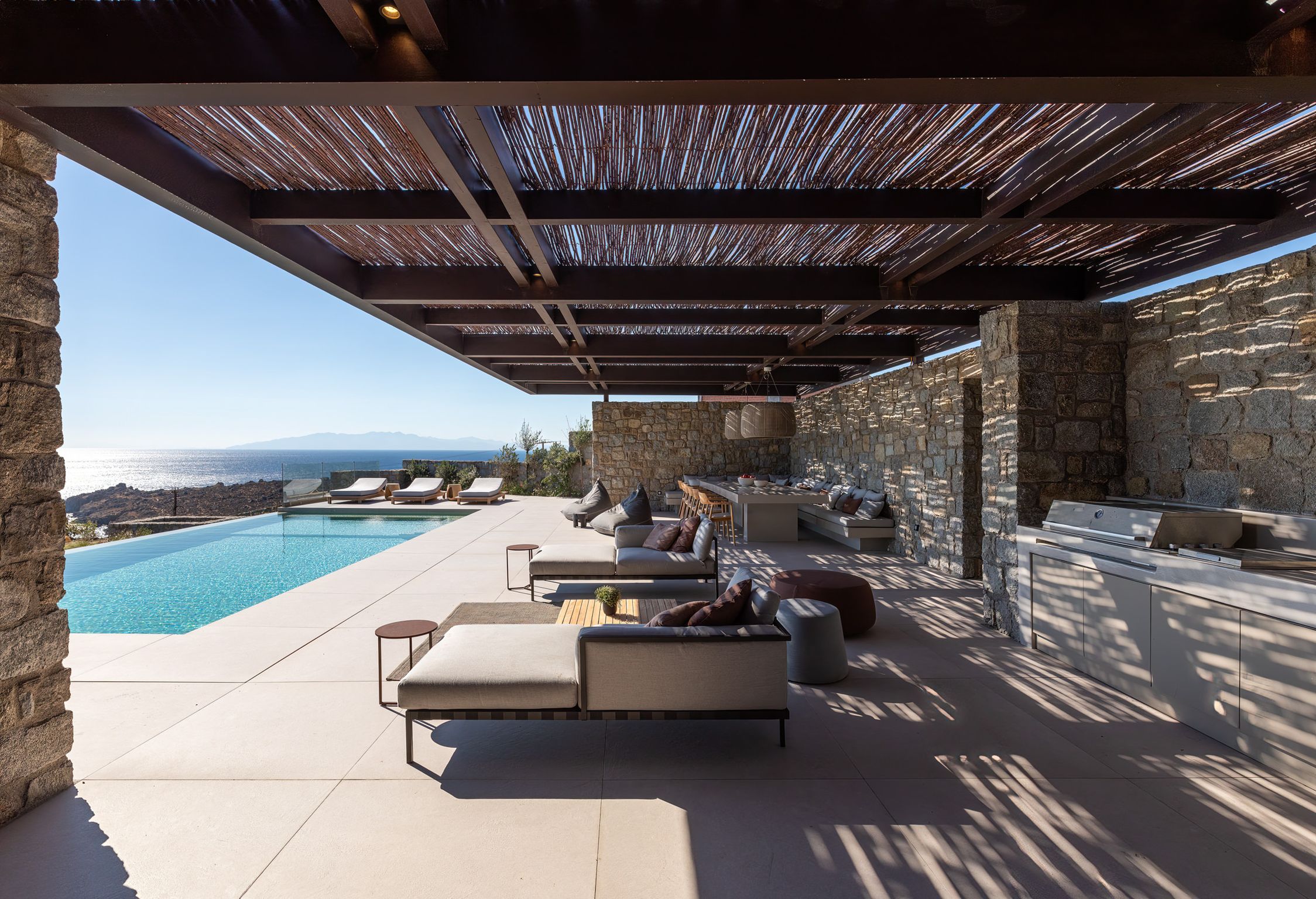 Infinity pool next to the covered stone terrace at Aether Private Retreat - Upper Floor, Aleomandra, Mykonos
