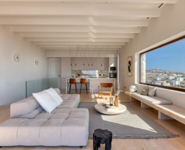 Contemporary living room with sofas and panoramic windows at Aether Private Retreat - Upper Floor, Aleomandra, Mykonos