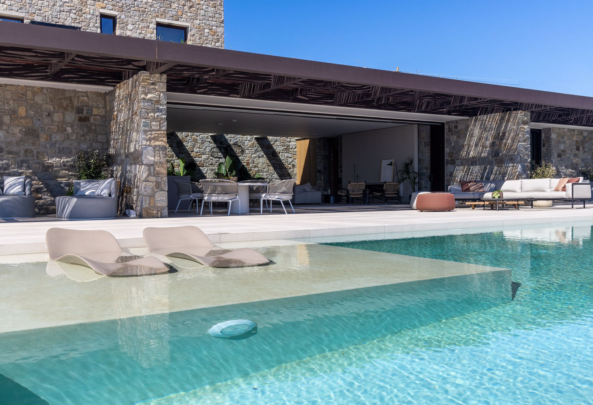 Infinity pool next to the covered stone terrace at Aether Private Retreat - Upper Floor, Aleomandra, Mykonos