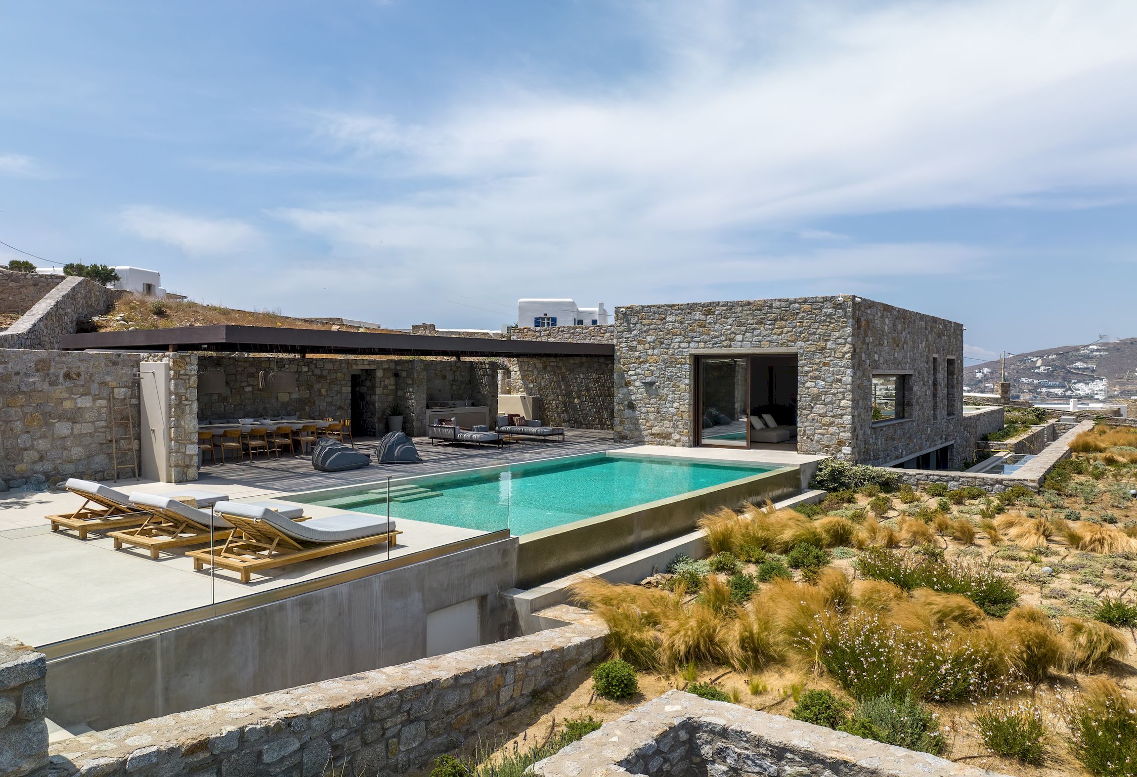 Aerial view of the villa, pools and surrounding Aleomandra landscape at Aether Private Retreat - Upper Floor, Aleomandra, Mykonos