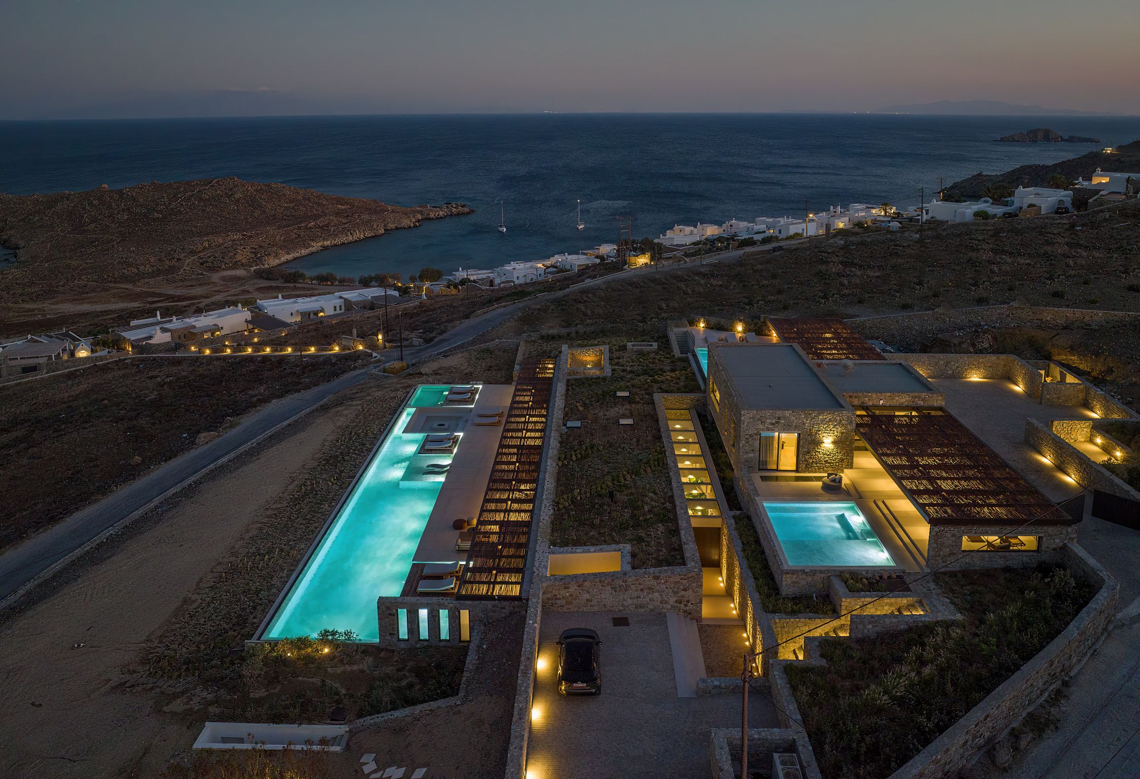 Aerial view of the villa and illuminated pools at night at Aether Private Retreat - Upper Floor, Aleomandra, Mykonos