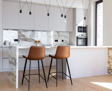 Fully equipped kitchen with island and bar stools at Aether Private Retreat - Upper Floor, Aleomandra, Mykonos