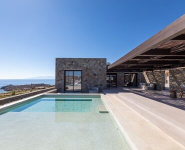 Pool terrace with shaded lounge area and sea views at Aether Private Retreat - Upper Floor, Aleomandra, Mykonos