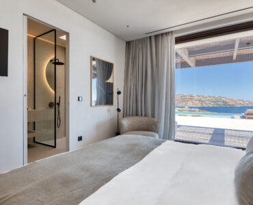 Bedroom with large window and sea view at Aether Private Retreat - Upper Floor, Aleomandra, Mykonos