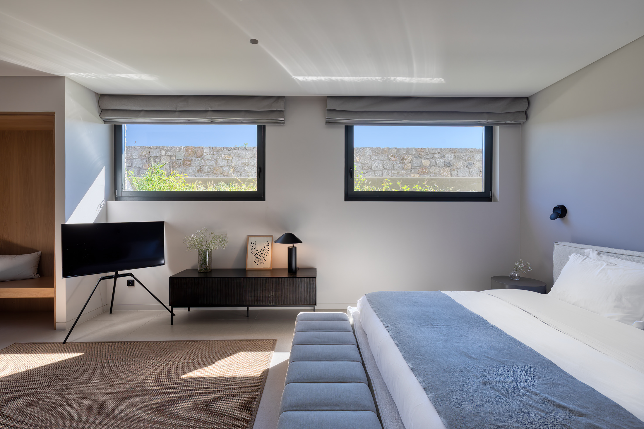 Bedroom with natural textures and soft neutral tones at Aether Private Retreat - Upper Floor, Aleomandra, Mykonos