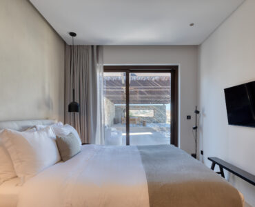 Bedroom with large window and sea view at Aether Private Retreat - Upper Floor, Aleomandra, Mykonos