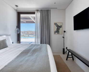 Bedroom with large window and sea view at Aether Private Retreat - Upper Floor, Aleomandra, Mykonos