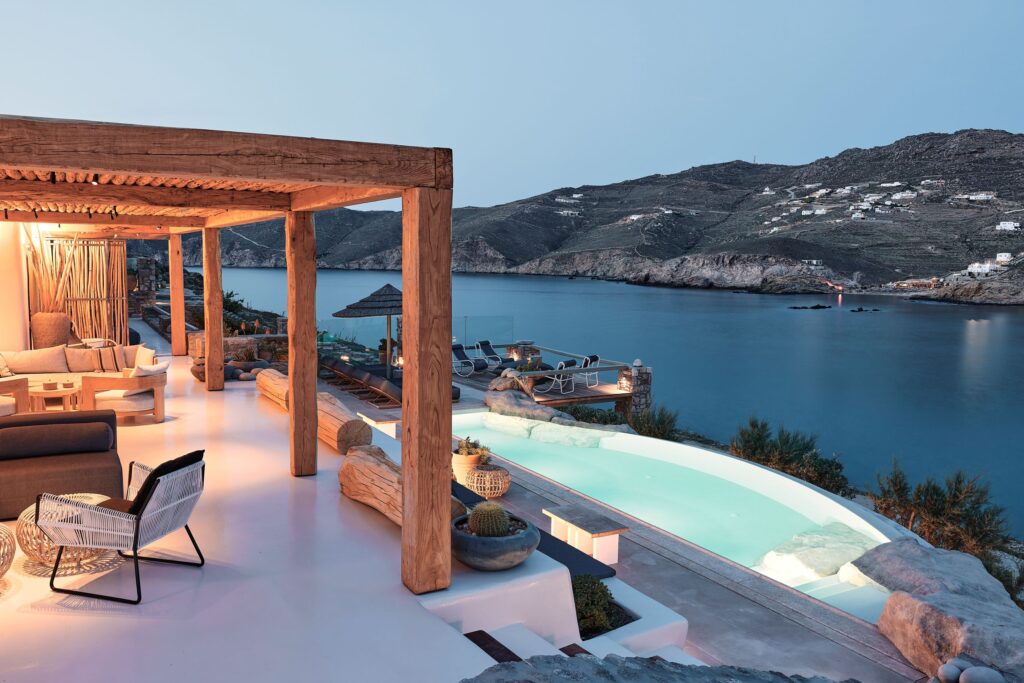 Infinity pool and terrace overlooking Ftelia bay at Bali Sea Front Villa in Ftelia, Mykonos