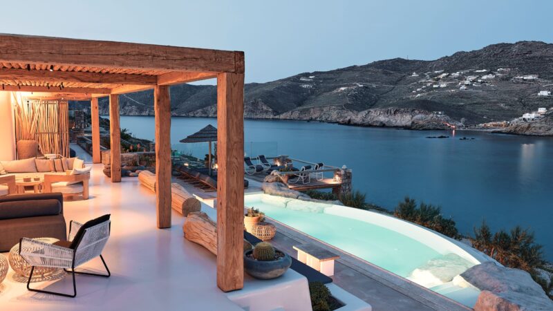 Infinity pool and terrace overlooking Ftelia bay at Bali Sea Front Villa in Ftelia, Mykonos