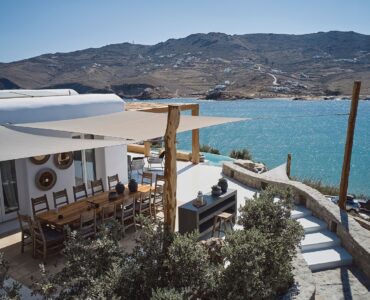Shaded BBQ and alfresco dining area with sea views at Bali Sea Front Villa in Ftelia, Mykonos