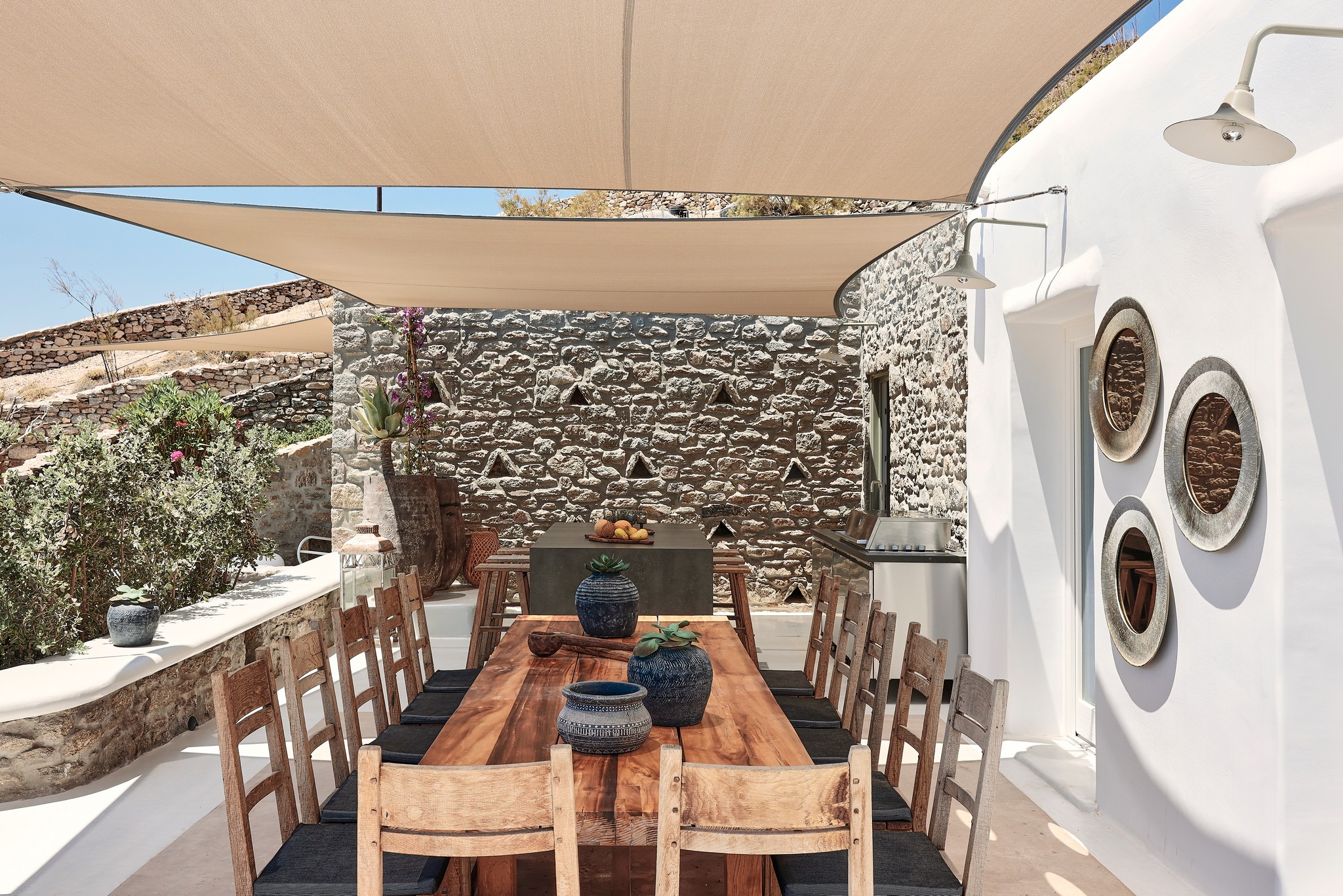 Shaded BBQ and alfresco dining area with sea views (view 3) at Bali Sea Front Villa in Ftelia, Mykonos