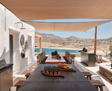 Shaded BBQ and alfresco dining area with sea views (view 4) at Bali Sea Front Villa in Ftelia, Mykonos