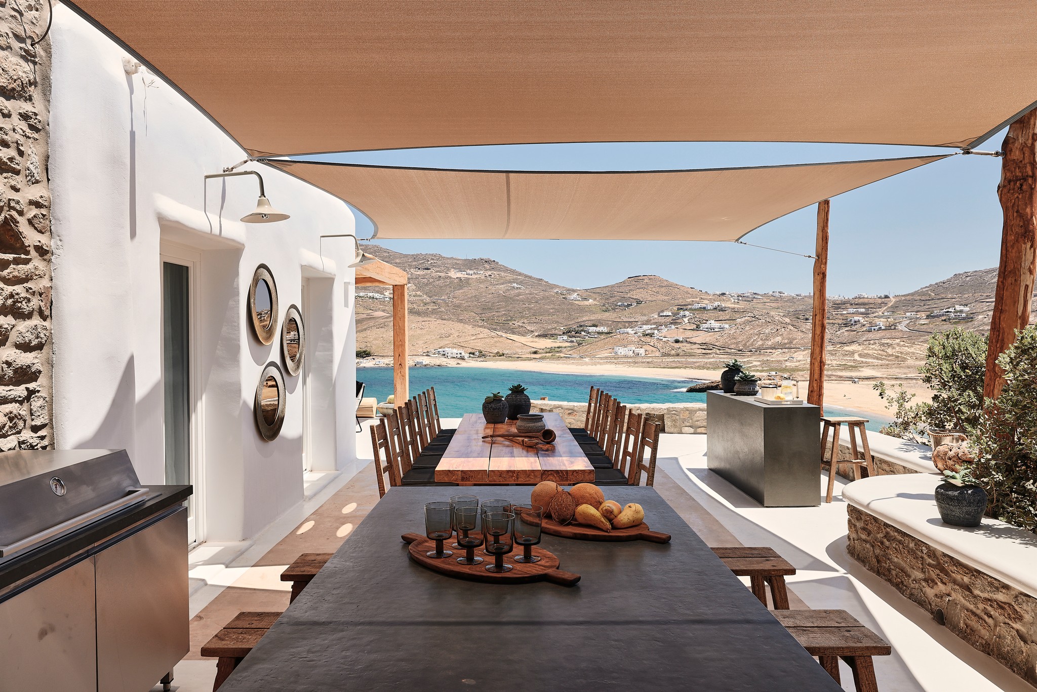 Shaded BBQ and alfresco dining area with sea views (view 4) at Bali Sea Front Villa in Ftelia, Mykonos
