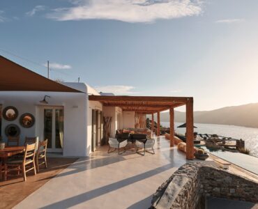 Shaded veranda lounge facing the Aegean Sea at Bali Sea Front Villa in Ftelia, Mykonos