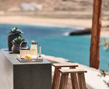 Shaded BBQ and alfresco dining area with sea views (view 6) at Bali Sea Front Villa in Ftelia, Mykonos