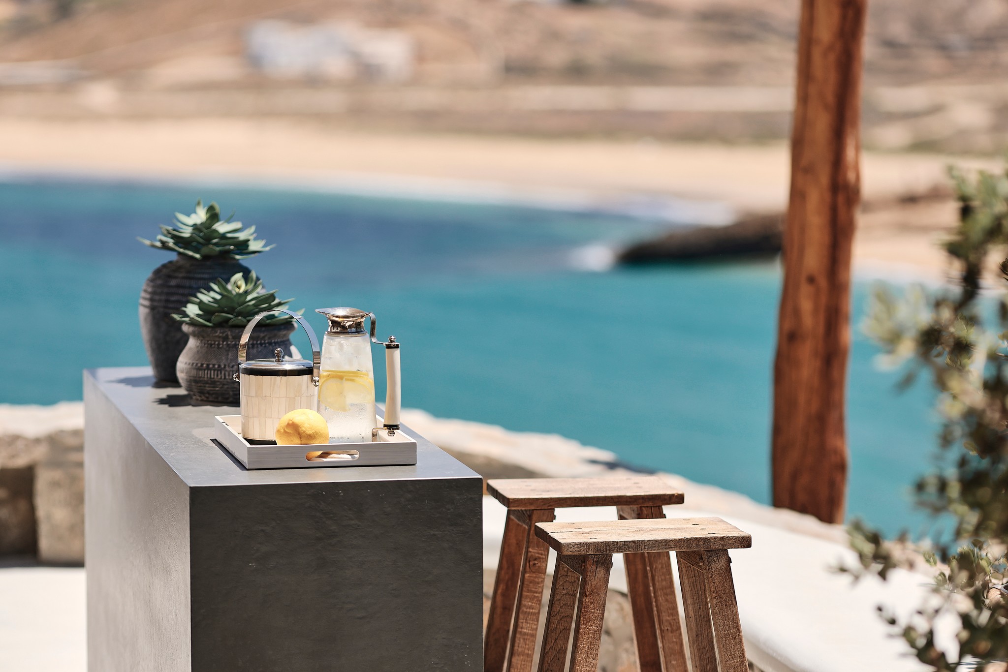 Shaded BBQ and alfresco dining area with sea views (view 6) at Bali Sea Front Villa in Ftelia, Mykonos