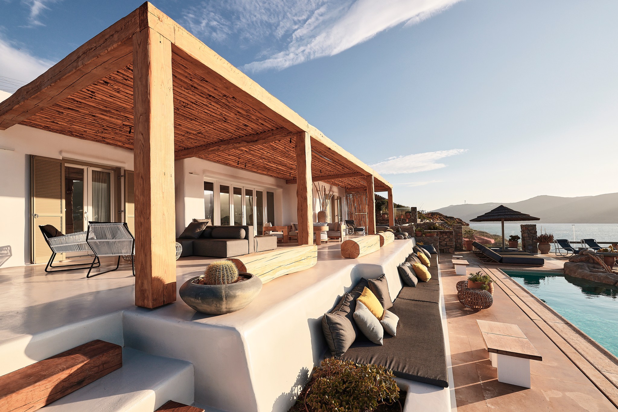 Shaded veranda lounge facing the Aegean Sea (view 2) at Bali Sea Front Villa in Ftelia, Mykonos