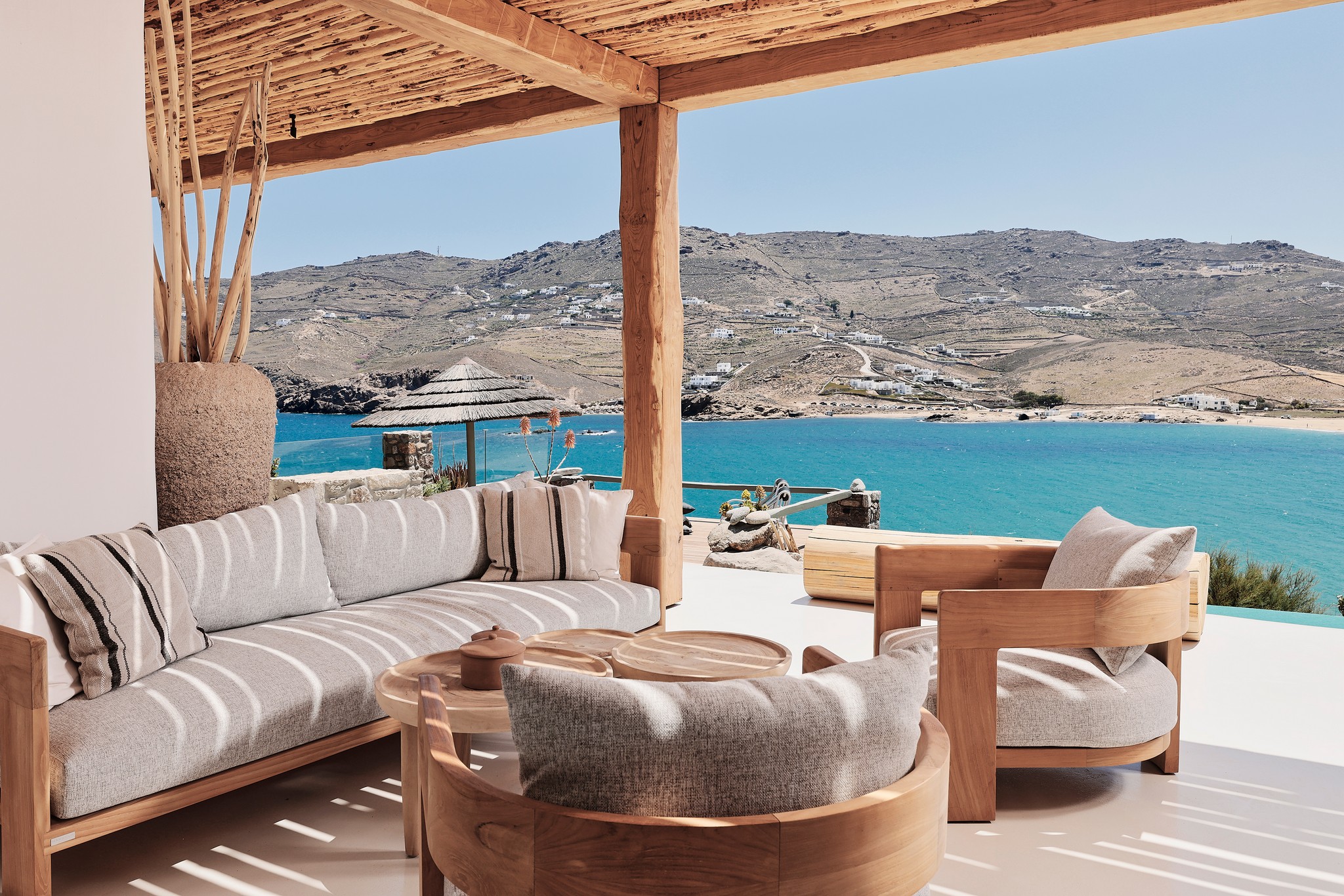 Shaded veranda lounge facing the Aegean Sea (view 4) at Bali Sea Front Villa in Ftelia, Mykonos