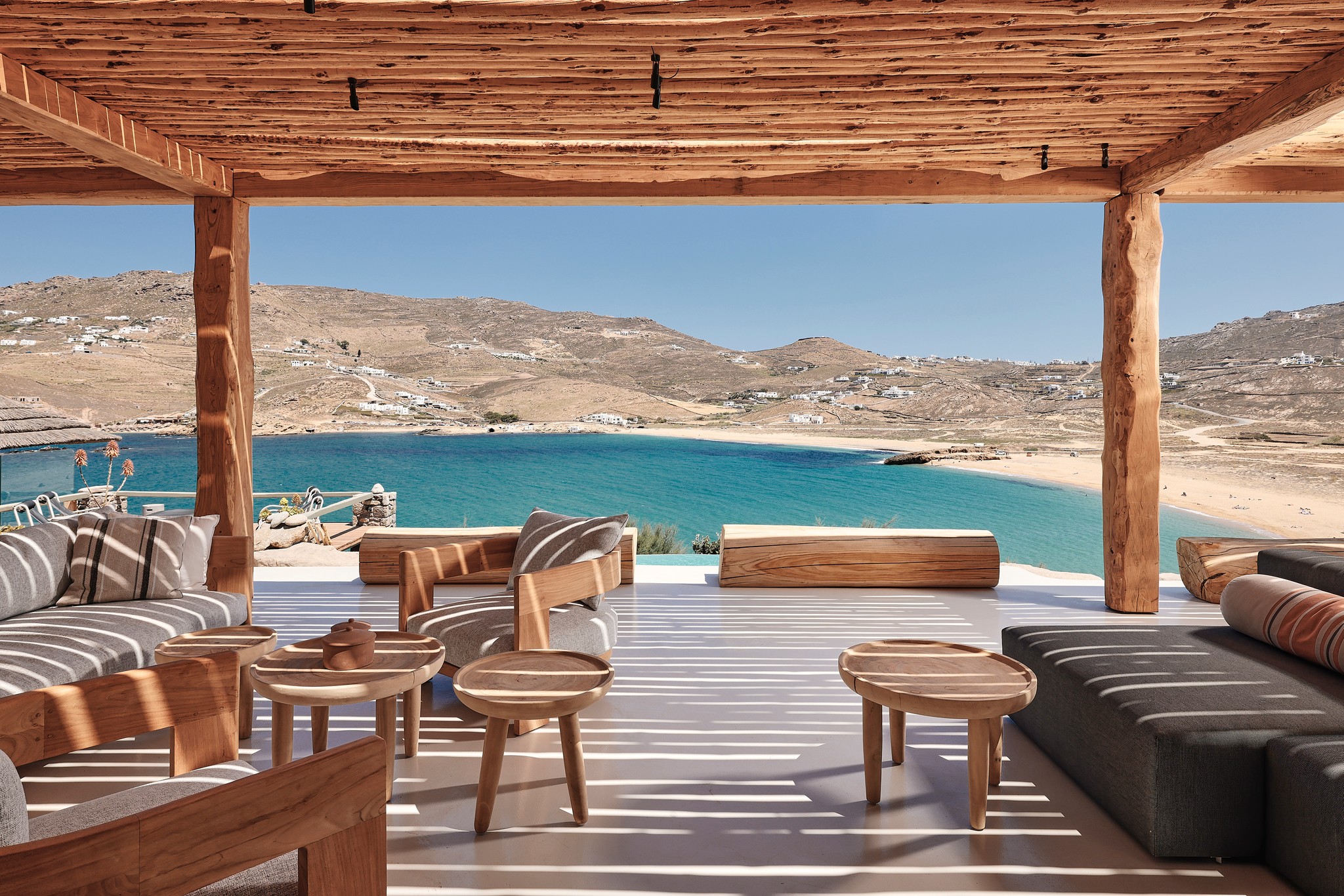 Shaded veranda lounge facing the Aegean Sea (view 5) at Bali Sea Front Villa in Ftelia, Mykonos