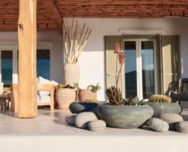 Master bedroom on the upper level of the main house at Bali Sea Front Villa in Ftelia, Mykonos
