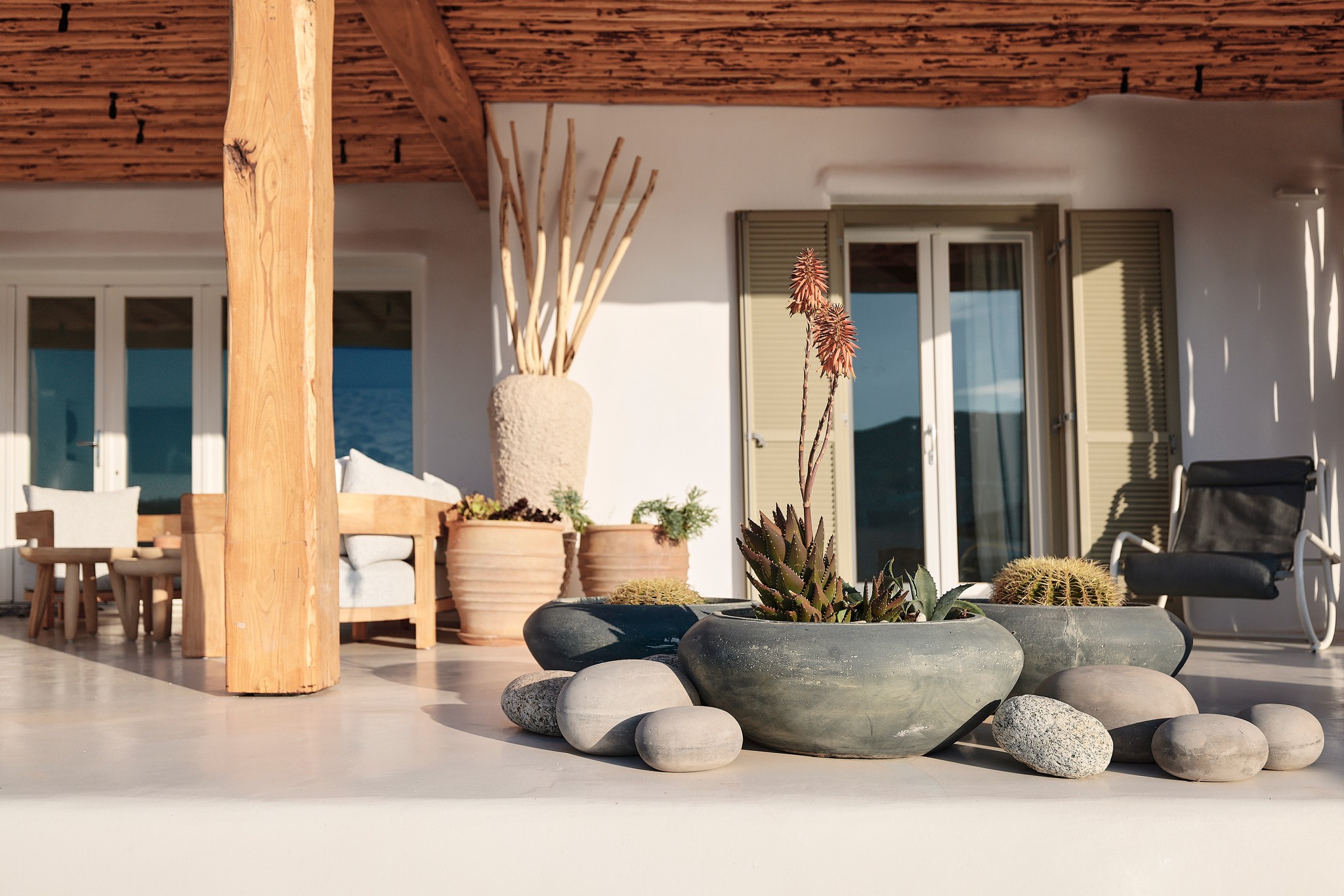Master bedroom on the upper level of the main house at Bali Sea Front Villa in Ftelia, Mykonos