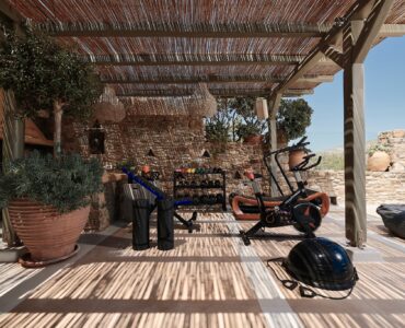 Outdoor gym area with sea views at Bali Sea Front Villa in Ftelia, Mykonos
