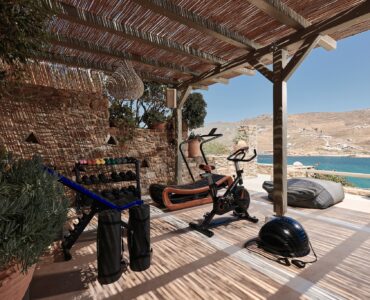 Outdoor gym area with sea views at Bali Sea Front Villa in Ftelia, Mykonos