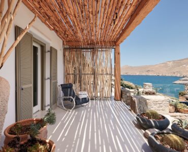 Master bedroom on the upper level of the main house (view 2) at Bali Sea Front Villa in Ftelia, Mykonos