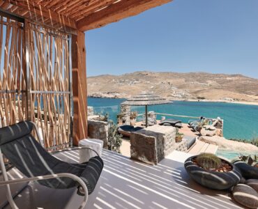 Master bedroom on the upper level of the main house (view 3) at Bali Sea Front Villa in Ftelia, Mykonos