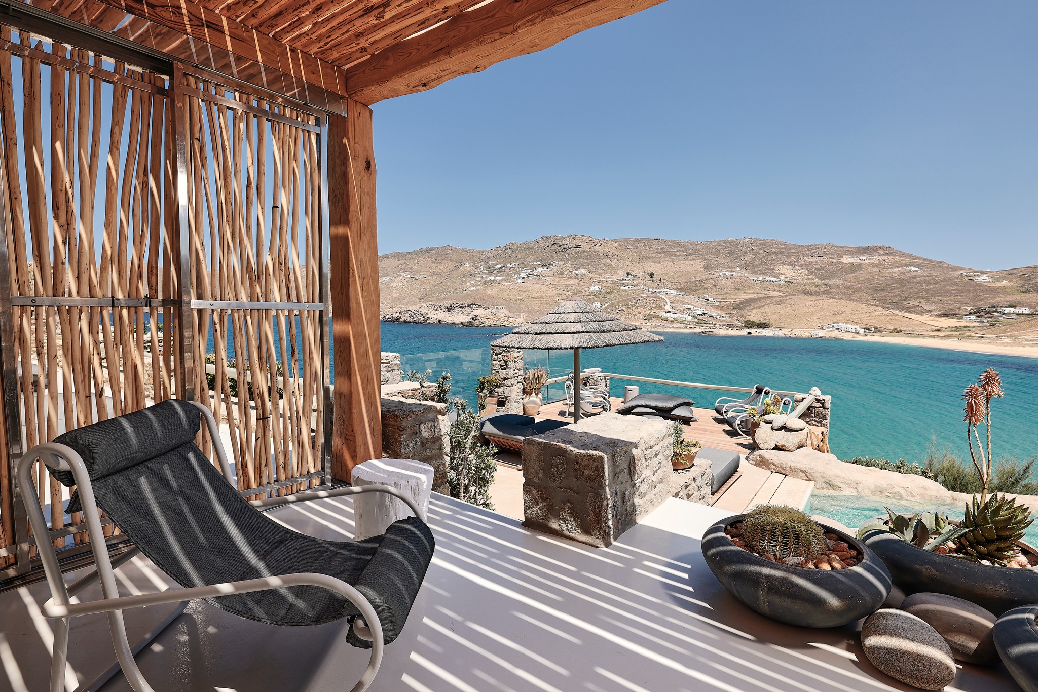 Master bedroom on the upper level of the main house (view 3) at Bali Sea Front Villa in Ftelia, Mykonos