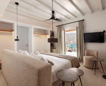 Master bedroom on the upper level of the main house (view 4) at Bali Sea Front Villa in Ftelia, Mykonos