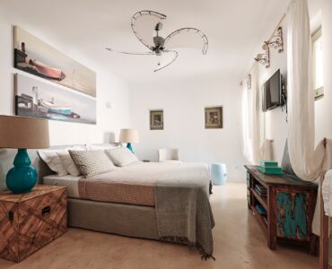 En suite bedroom on the upper level of the main house at Bali Sea Front Villa in Ftelia, Mykonos